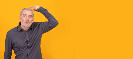 isolated adult or senior man thinkingの写真素材