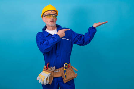 adult man with clothing and equipment for construction work, laborerの写真素材