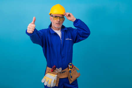 adult man with clothing and equipment for construction work, laborer
