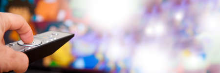 hand with command or control of the televisionの写真素材