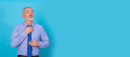 businessman with tie isolated on color backgroundの写真素材