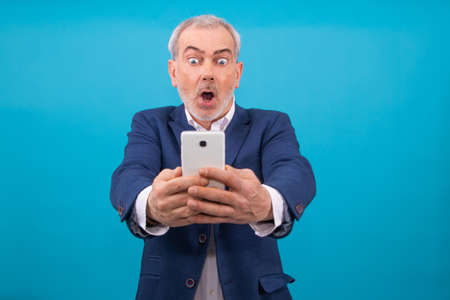 businessman with mobile phone isolated on backgroundの写真素材