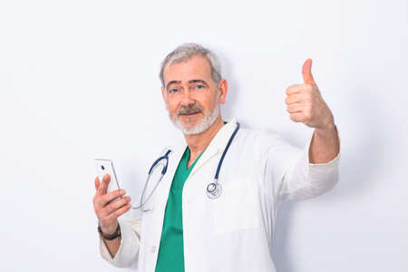 portrait of doctor with mobile phone isolated on white