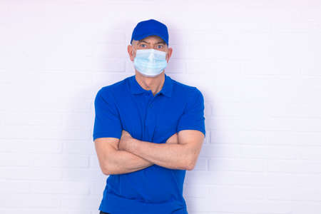 worker with face mask isolated on background