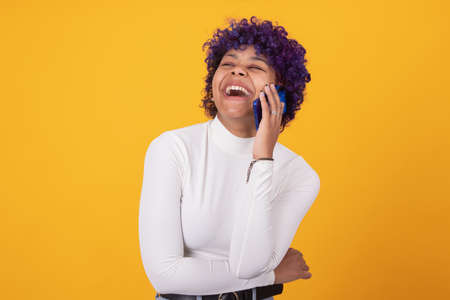 girl or woman with mobile phone isolated on color background
