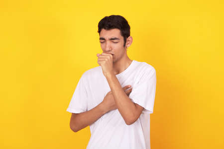 young male teenager isolated on color backgroundの写真素材