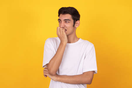 young male teenager isolated on white background wearing shirtの写真素材
