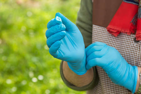 hands with sanitary latex glovesの写真素材