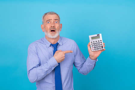 businessman with calculator stressed out and isolated on background