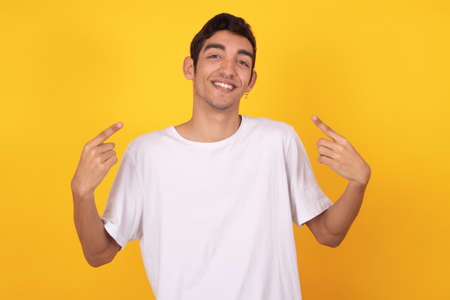 young male isolated on color backgroundの写真素材