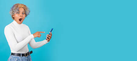 isolated afro american girl with mobile phone and space for text or ads