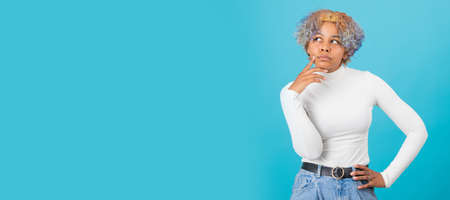 young afro american girl thinking isolated on color background