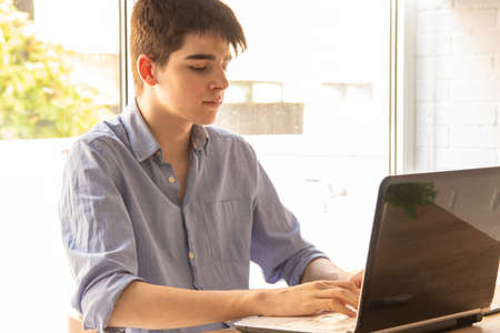 student at home with computer working
