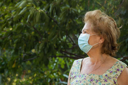 portrait of senior woman with face mask