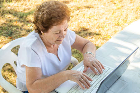 senior woman working with laptopの写真素材