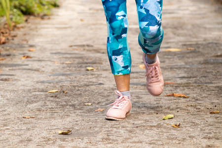 closeup of athlete woman feet runningの写真素材