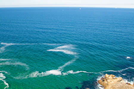 rocky cliff to the sea in pontevedra, galicia, spain