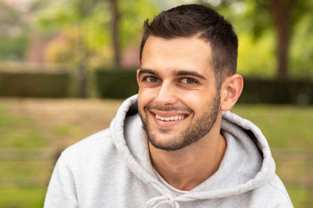 portrait of young man with beard outdoorsの写真素材