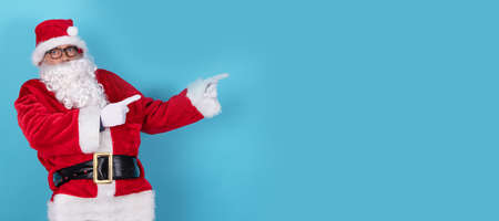 santa claus pointing isolated on backgroundの写真素材