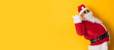 santa claus isolated on background pointing for ad or textの写真素材