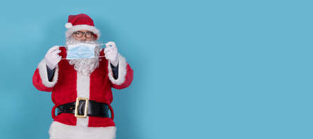 santa claus with sanitary mask isolated on backgroundの写真素材