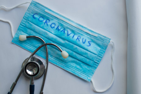 sanitary mask and stethoscope in the coronavirus pandemicの写真素材