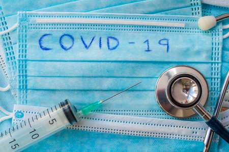 coronavirus pandemic mask and vaccineの写真素材