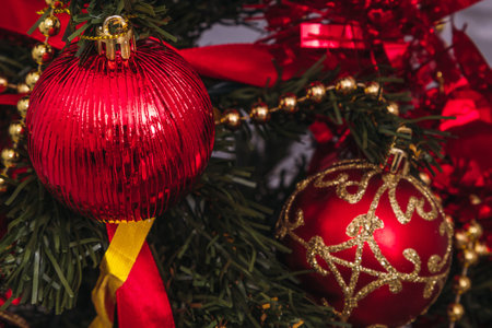 christmas balls and ornaments on the treeの写真素材