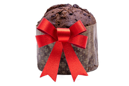 chocolate panettone with red christmas bow isolated on white backgroundの写真素材