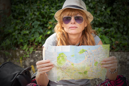 travel or excursion woman with mapの写真素材