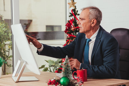 businessman at christmas working in the officeの写真素材