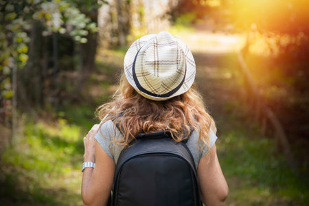 woman with backpack on excursion or tripの写真素材