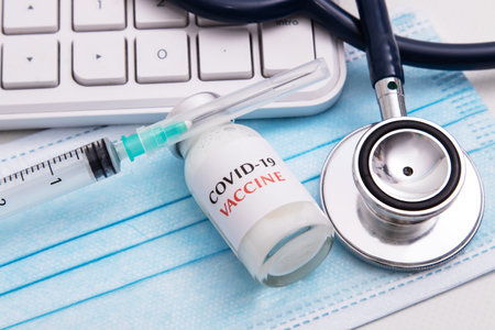 coronavirus vaccine vial in healthcare medical backgroundの写真素材