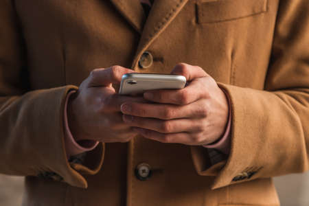 close-up of hands with mobile phone