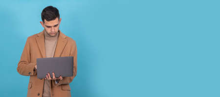 isolated man with laptop in backgroundの写真素材