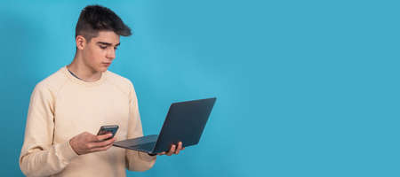 teenager or student with mobile phone and computer isolatedの写真素材