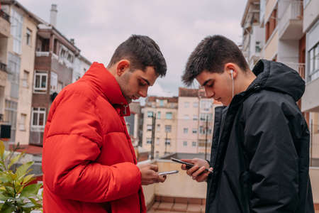 young people in the city with mobile phone outdoorsの写真素材