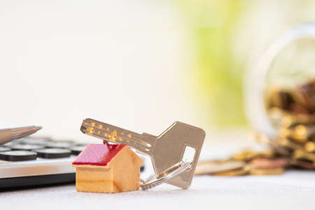 keys with house and money, house purchase conceptの写真素材