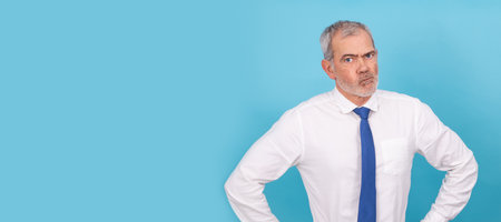 isolated businessman with distrustful expressionの写真素材