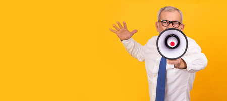 isolated businessman shouting into megaphoneの写真素材