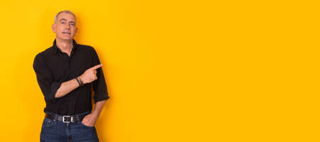 isolated adult man pointing to spaceの写真素材