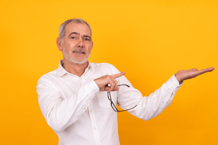 senior adult man pointing with handの写真素材