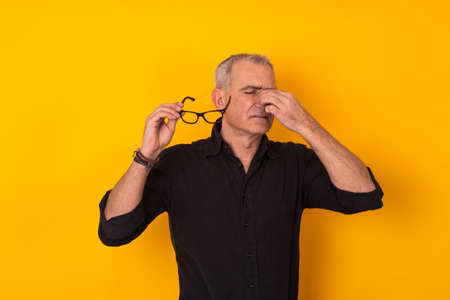 isolated adult man with glasses and pain or stress expressionの写真素材