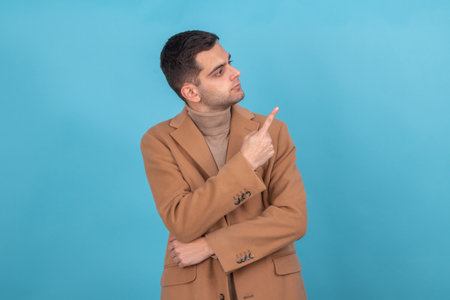 man with isolated coat pointingの写真素材