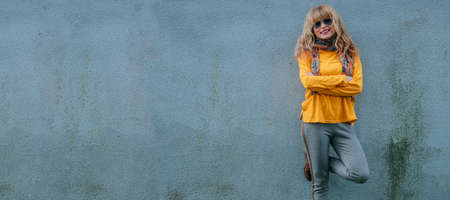 woman on outdoor street wallの写真素材