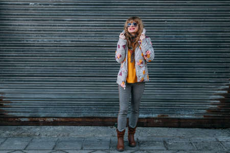 middle-aged adult woman on the street outdoors
