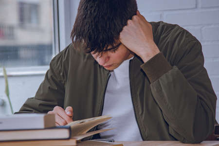teenage boy studying at homeの写真素材