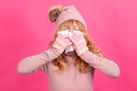 cold or allergy woman with handkerchief isolatedの写真素材