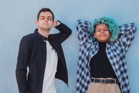 relaxed young couple in the street outdoorsの写真素材