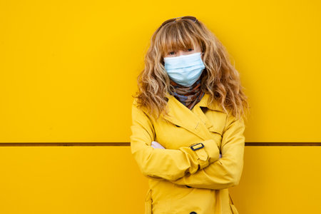 woman with mask on the streetの写真素材